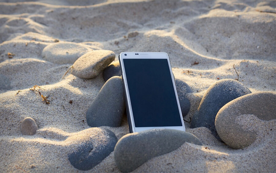 cell phone in the sand