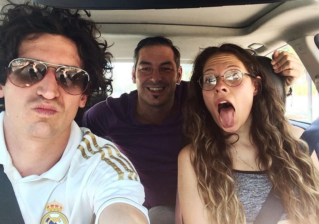 three people in a car