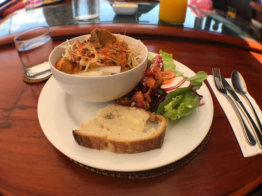 bowl of food close up with bread and salad